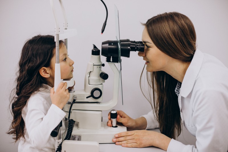 little girl checking up her sight ophthalmology center - Eye Health